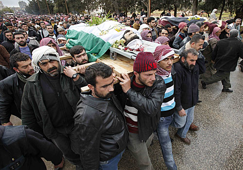 In the city of Idlib, a funeral is held for rebels and a 10-year-old boy. The U.N. and Arab League are considering a joint observer mission to Syria.