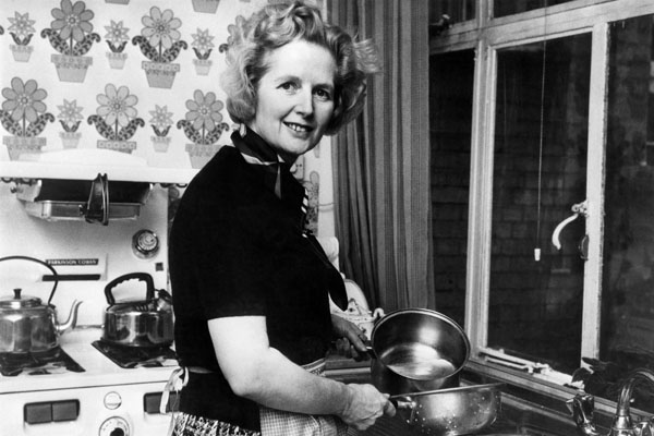 British Conservative Party leader Margaret Thatcher, then 49, posing in the kitchen of her Chelsea home in London following her election at the head of the Tory.
