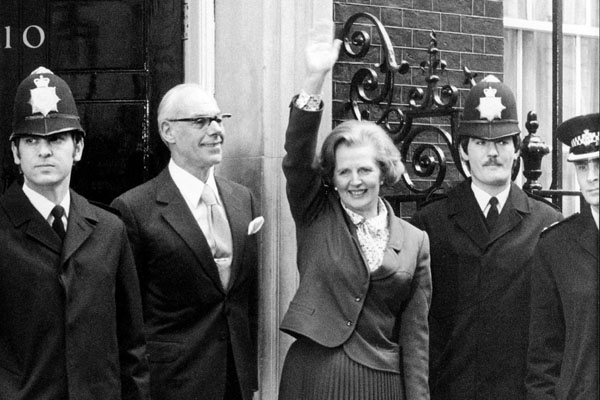 Margaret Thatcher waving as she arrives to take office at 10 Downing Street in London.