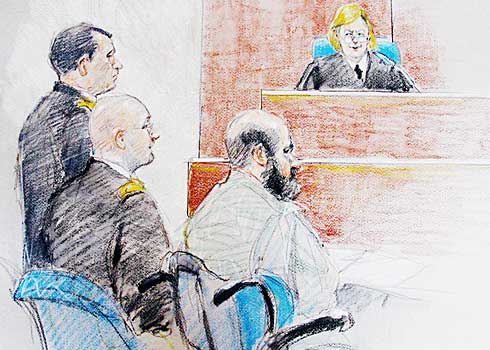 Col. Tara Osborn, the judge in the case, said the
"defense of others" strategy proposed by Army Maj. Nidal Malik Hasan, with beard, "failed as a matter of law."
