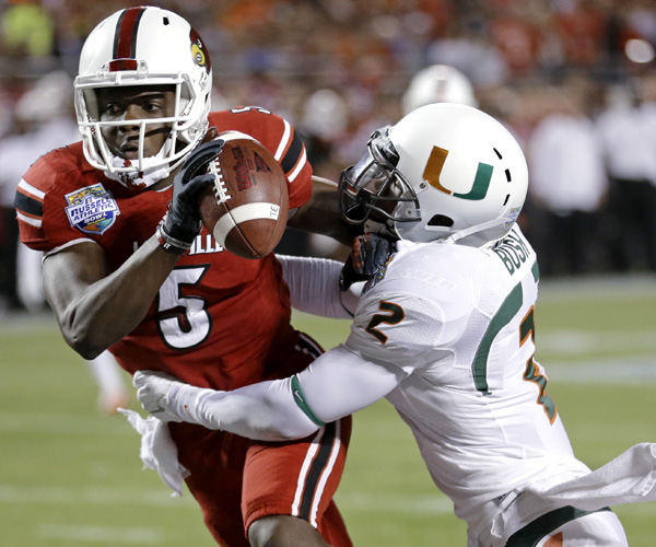 Although Miami defensive back Deon Bush sacked Louisville quarterback Teddy Bridgewater in the end zone for a safety on this play in the first half, Bridgewater passed for three touchdowns to lead the Cardinals to a 36-9 victory in the Russell Athletic Bowl.