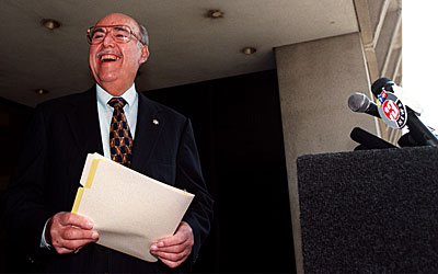 Sheriff Sherman Block, outside Sheriff's Department headquarters, talks to reporters and offers to debate Lee Baca. (July 16, 1998)