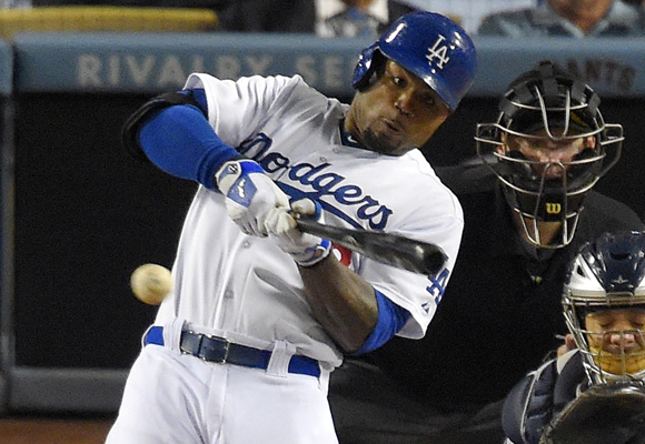 Dodgers left fielder Carl Crawford hits a run-scoring double during the eighth inning of a 4-0 win over the San Diego Padres.