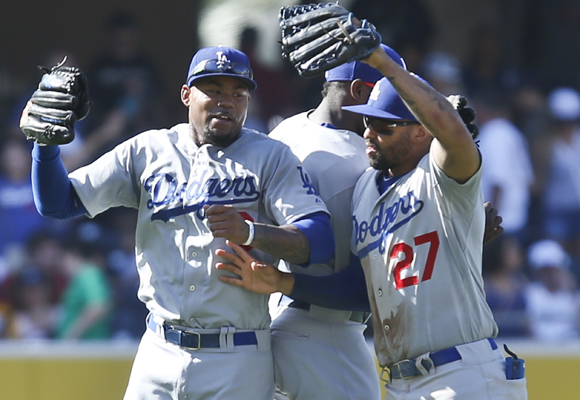 Dodgers outfielders (from left to right) Yasiel Puig, Carl Crawford and Matt Kemp celebrate the team's 7-1 win over the San Diego Padres.