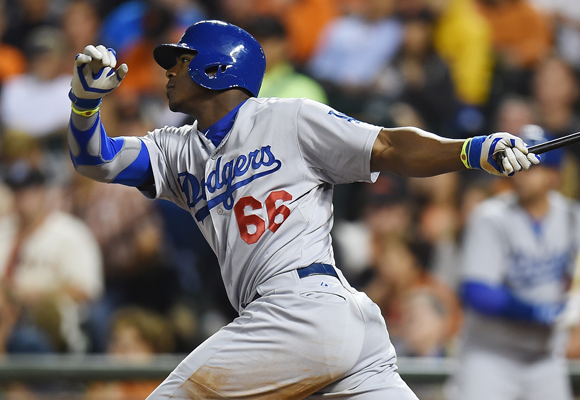 Dodgers outfielder Yasiel Puig hits his second triple during the fifth inning of the team's 8-1 win over the San Francisco Giants.