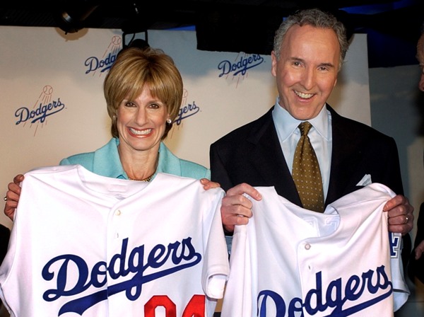 Then married Jamie and Frank McCourt hold Los Angeles Dodgers jerseys after announcing in 2004 that Major League Baseball had approved the purchase of the Dodgers.