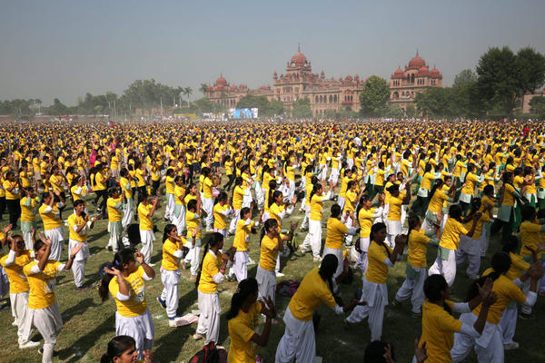 School children perform to attempt to enter the Guinness Book of World Records for a five-minute synchronized performance with the largest gathering of participants, at Khalsa College in Amritsar, India in October 2015.