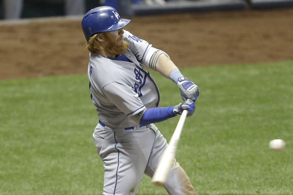 Dodgers third baseman Justin Turner hits a three-run home run during the sixth inning of a win over the Milwaukee Brewers.
