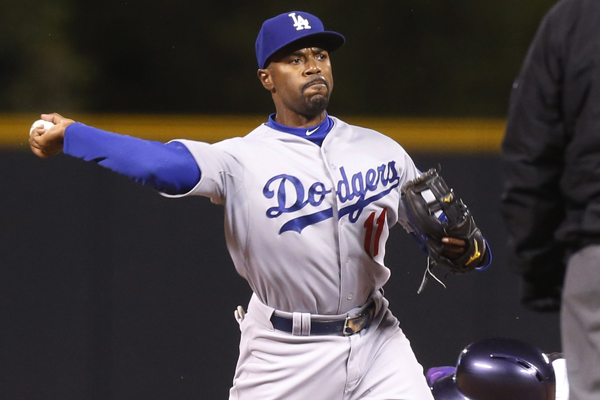 Dodgers shortstop Jimmy Rollins turns a double play during the first inning of a win over the Colorado Rockies.