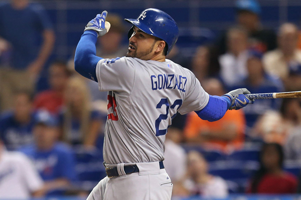 Dodgers first baseman Adrian Gonzalez hits a run-scoring single during the fourth inning of a 3-2 loss to the Miami Marlins.
