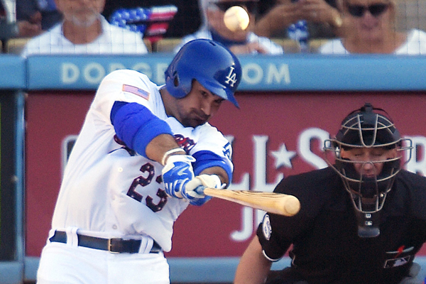 Dodgers first baseman Adrian Gonzalez hits a solo home run during the fifth inning of a 4-3 win over the New York Mets.