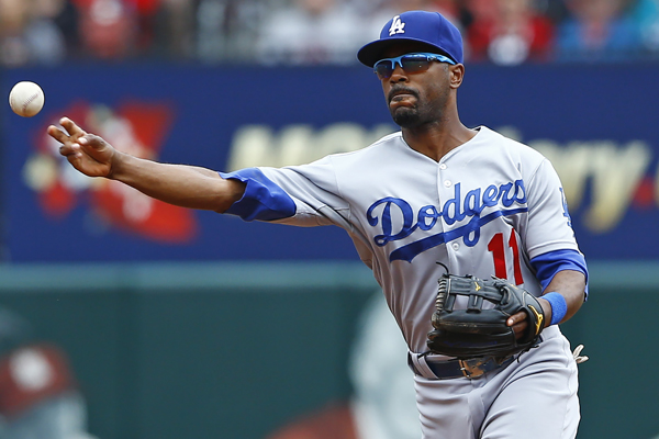 Dodgers shortstop Jimmy Rollins makes a throw to first base during the first inning of a loss to the St. Louis Cardinals.