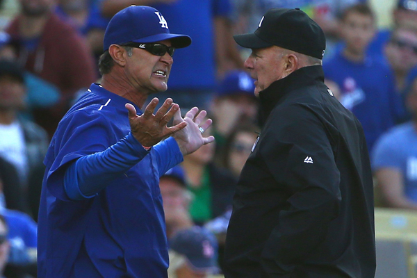 Dodgers Manager Don Mattingly argues a call with third base umpire Bob Davidson during the fourth inning of a loss to the Miami Marlins.