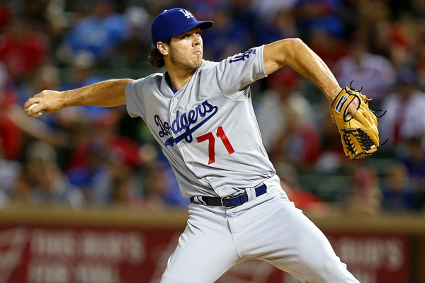 Dodgers reliever Josh Ravin delivers a pitch during the ninth inning of a loss to the Texas Rangers.