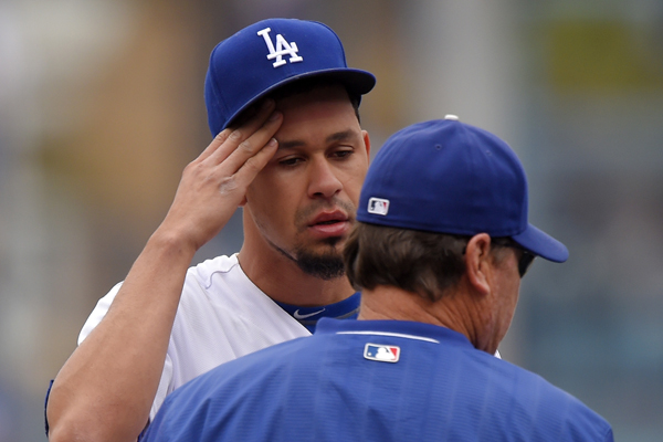 Dodgers pitcher Carlos Frias speaks with pitching coach Rick Honeycutt during the first inning of an 11-3 loss to the San Diego Padres.