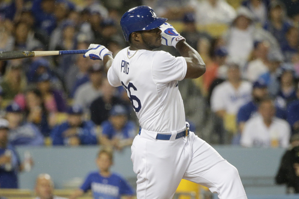 Dodgers right fielder Yasiel Puig hits a double during the seventh inning of a win over the Arizona Diamondbacks.