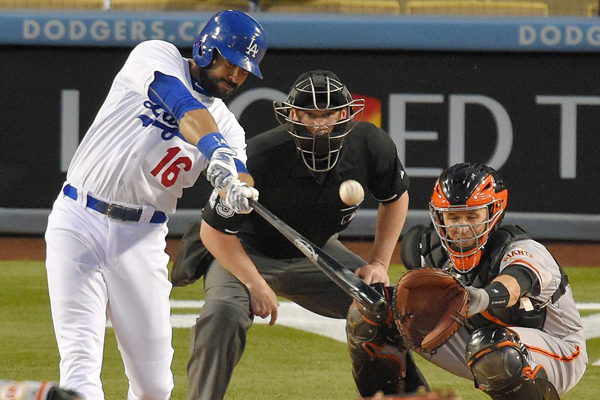 Dodgers right fielder Andre Ethier hits a two-run home run in front of San Francisco Giants catcher Buster Posey during the first inning of a 7-3 victory.