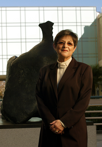 Andrea Rich, president and director of LACMA, stands in front of Henry Moore's bronze statue <a href="http://collections.lacma.org/node/234869" target="_blank">"Three–Part Reclining Figure."</a>