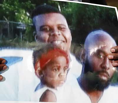 Michael Brown, top left, is pictured with his father, Michael Sr.