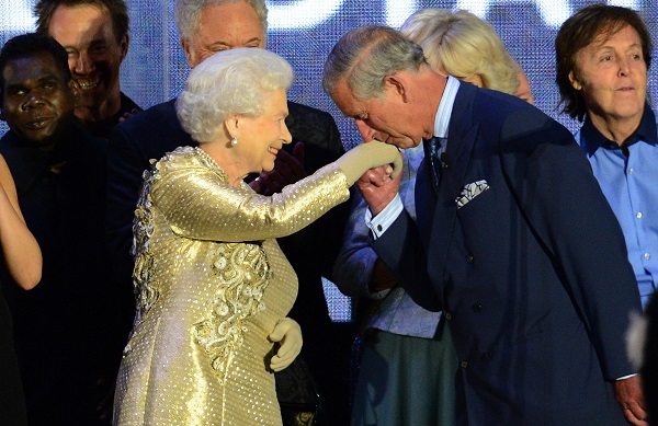Prince Charles kisses his mother's hand at a Jubilee week concert at Buckingham Palace on June 4, 2012.