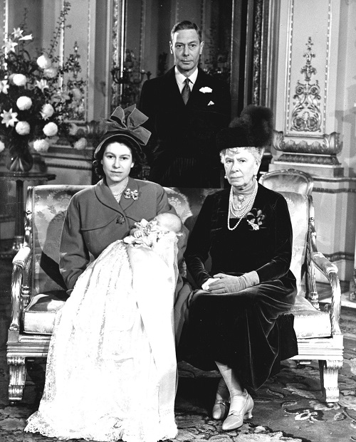 Princess Elizabeth holds her son, Prince Charles, in a portrait at Buckingham Palace following his christening Dec. 15, 1948. With Elizabeth are her grandmother, Queen Mary, and father, King George VI.