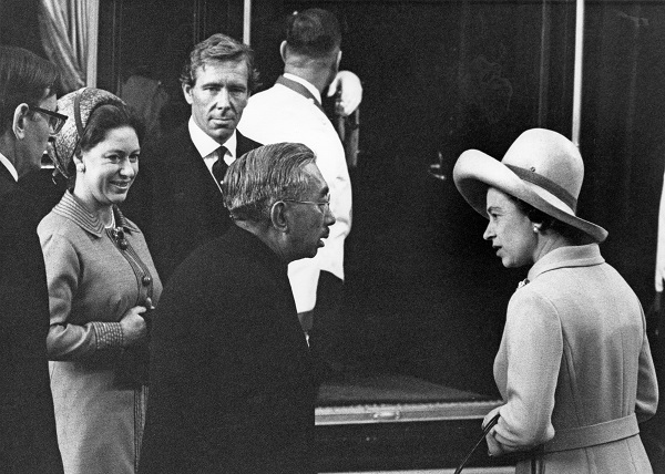 Queen Elizabeth II chats with Emperor Hirohito of Japan at Victoria Station at the start of his four-day state visit to London on Oct. 5, 1971. On the left are the queen's sister, Princess Margaret, and her husband, Antony Armstrong-Jones, 1st Earl of Snowdon.