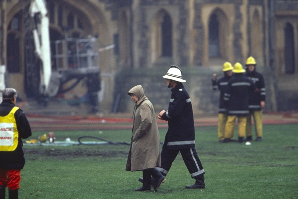Queen Elizabeth II inspects the damage after a fire at Windsor Castle in November 1992.