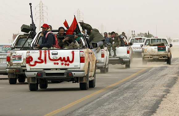 Rebel fighters flee from Ajdabiyah.
