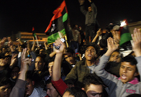 Streets erupt in cheers as news of the U.N. Security Council vote reach Libyan rebels in the eastern seaside city of Tobruk.
