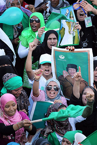 Supporters of Moammar Kadafi shout slogans during a pro-regime rally in Tripoli.