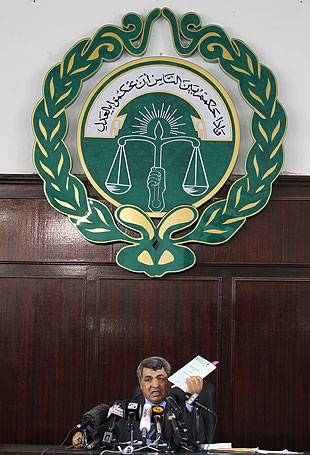 Judge Khalifa Isa Khalifa announces treason charges against 21 rebel leaders.