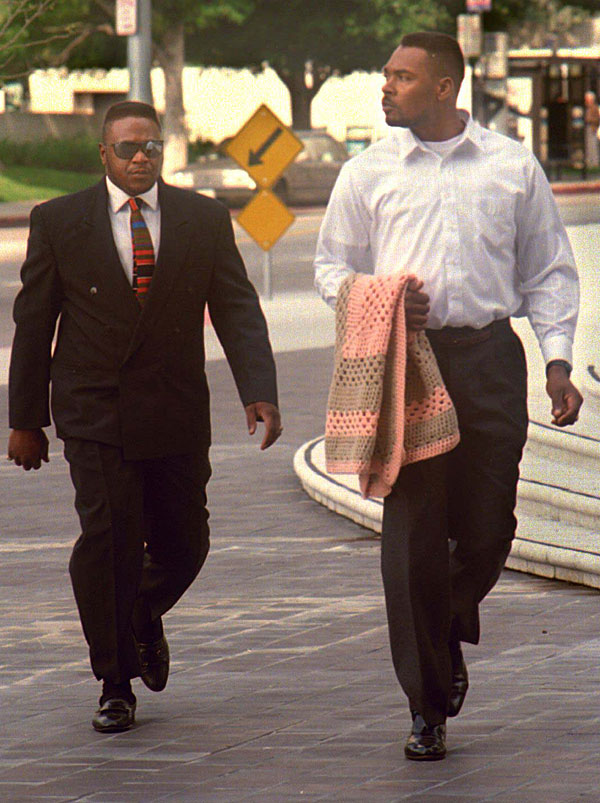 Rodney G. King, right, and unidentified man walking toward federal courthouse. 
