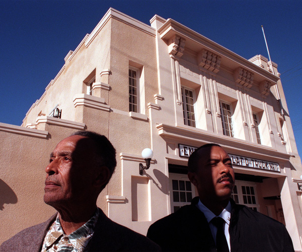 Arnett Hartsfield and Brent Burton stand in front of the African American Firefighter Museum, which was refurbished from the Fire Station 30 building. 