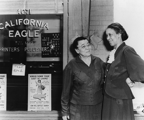 Charlotta Bass, left, with her niece in front of the California Eagle in 1944.