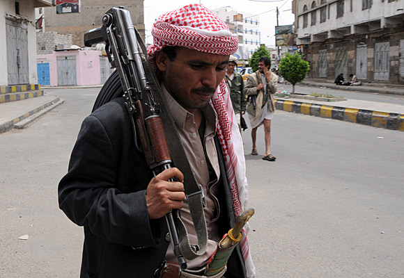Tribesmen loyal to anti-government protesters demanding an end to the rule of Yemeni President Ali Abdullah Saleh patrol a street in Sana, the capital.