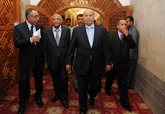 Yemeni Prime Minister Mohammed Basindwa, left, and Vice President Abdu Rabu Mansour Hadi arrive at the presidential palace in Sana.