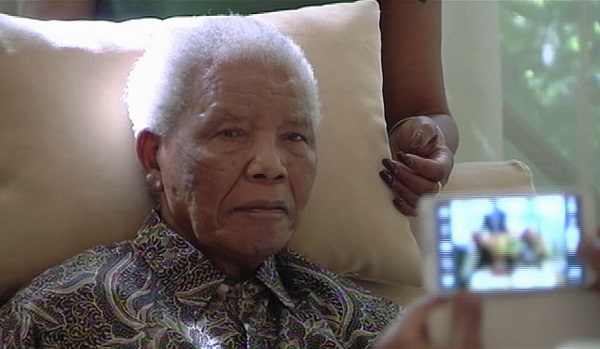 Mandela pictured more than three weeks after his April release from hospital. 