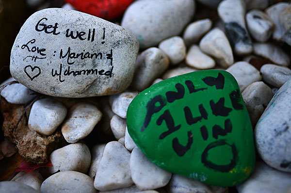 Stones painted with get-well messages are left outside Mandela's residence in the Houghton area of Johannesburg.

