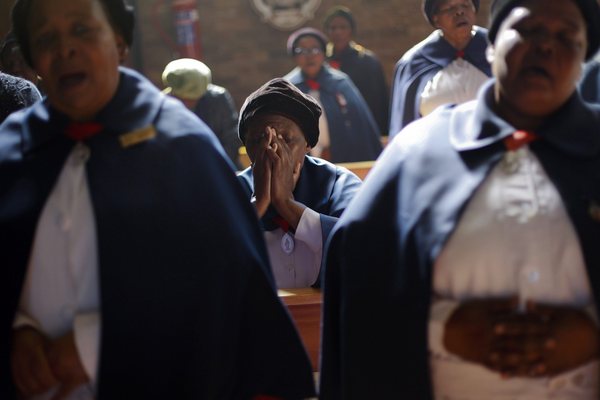 Congregants sing as they pray for Mandela during Sunday service at Regina Mundi church in Soweto township.