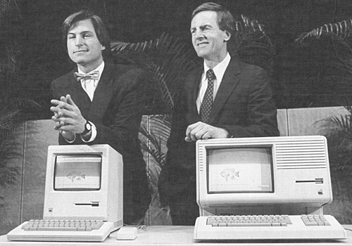 Steve Jobs, left, John Sculley, Macintosh, left, and Lisa 2