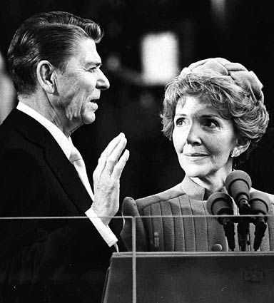 Nancy Reagan watches as her husband, Ronald Reagan, takes the oath of office