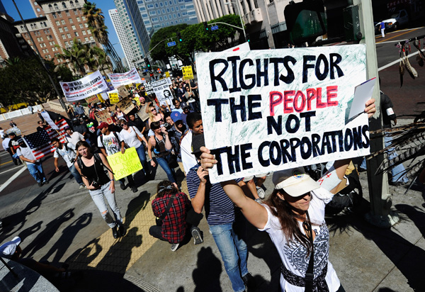 Protestors march to L.A. City Hall in solidarity with the Occupy Wall Street movement.