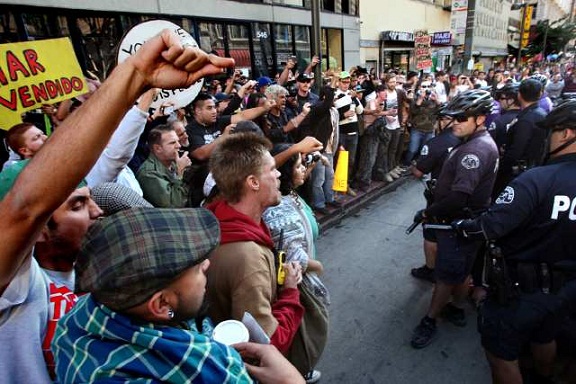 Members of the Occupy Los Angeles movement face off with police officers during a march through downtown L.A. (Dec. 3, 2011)