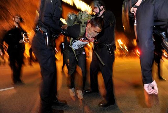 LAPD officers arrest an Occupy L.A. protester. (Nov. 30, 2011)