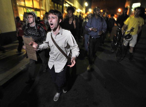 Demonstrators with Occupy Boston march toward the police station, where fellow demonstrators were taken after arrests. (Oct. 11, 2011)