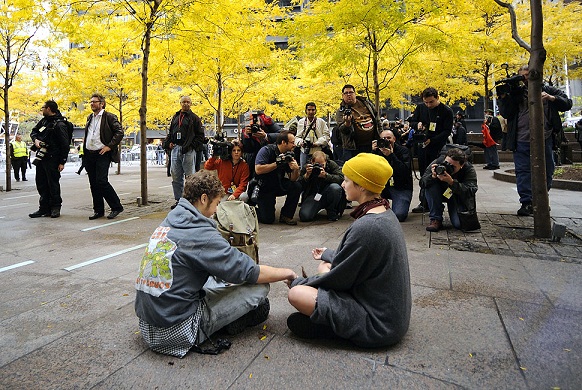 People meditate in Zuccotti Park after police remove hundreds of Occupy Wall Street demonstrators.