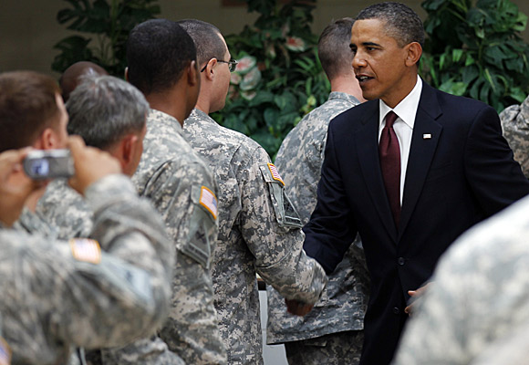 President Obama meets with troops at Ft. Bliss, Texas. "It's time to turn the page," he said.