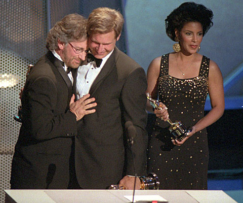 Steven Spielberg accepts the best picture Oscar from Harrison Ford for "Schindler
