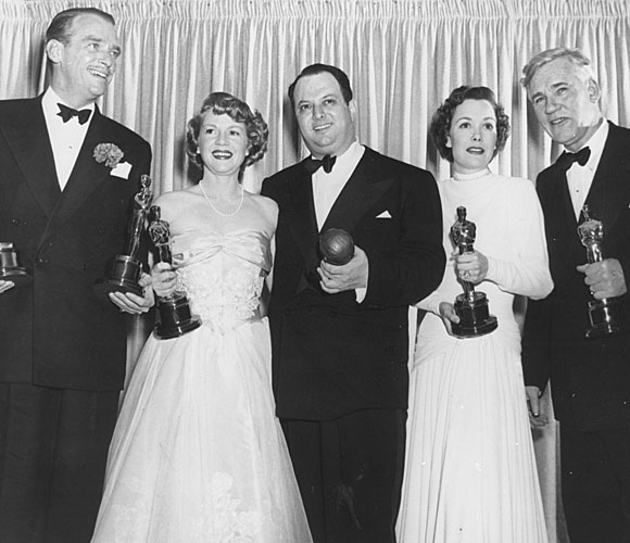 Douglas Fairbanks Jr., left, accepting for Laurence Olivier, Claire Trevor, Jerry Wald, Jane Wyman and Walter Huston.
