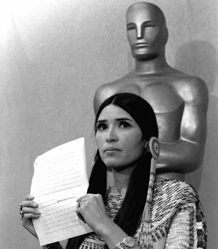 Sacheen Littlefeather holds up a statement that she read to the press March 27, 1973, at the Academy Awards ceremony in Los Angeles on behalf of Marlon Brando.